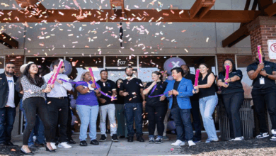 Staff and community members celebrate the grand opening of the city of Lawrenceville's first Xfinity store.