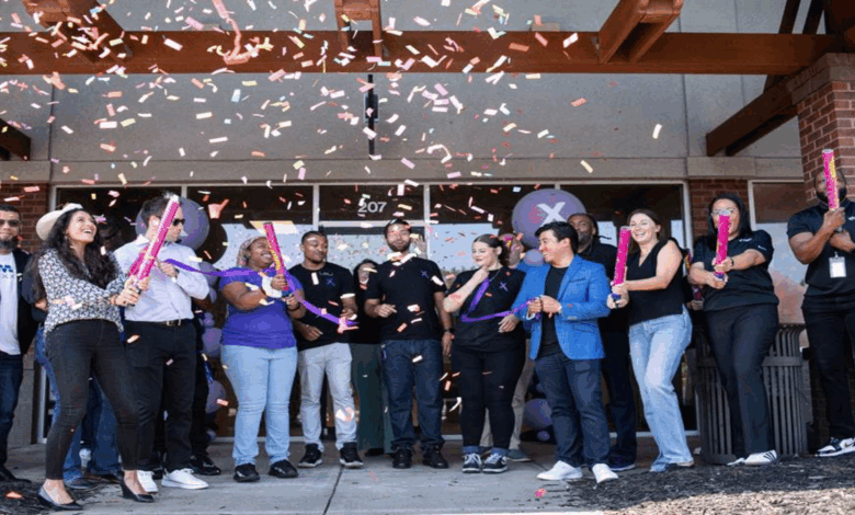 Staff and community members celebrate the grand opening of the city of Lawrenceville's first Xfinity store.